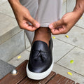 Men’s tassel slip-on sneaker in black leather
