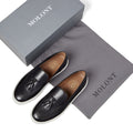 Men’s tassel slip-on sneaker in black leather